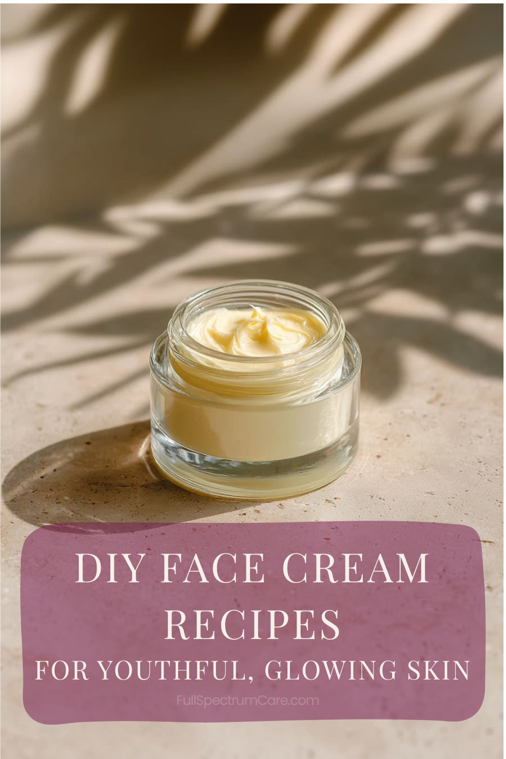 Homemade face cream in a small glass jar with natural ingredients, styled in a minimal spa setting.
