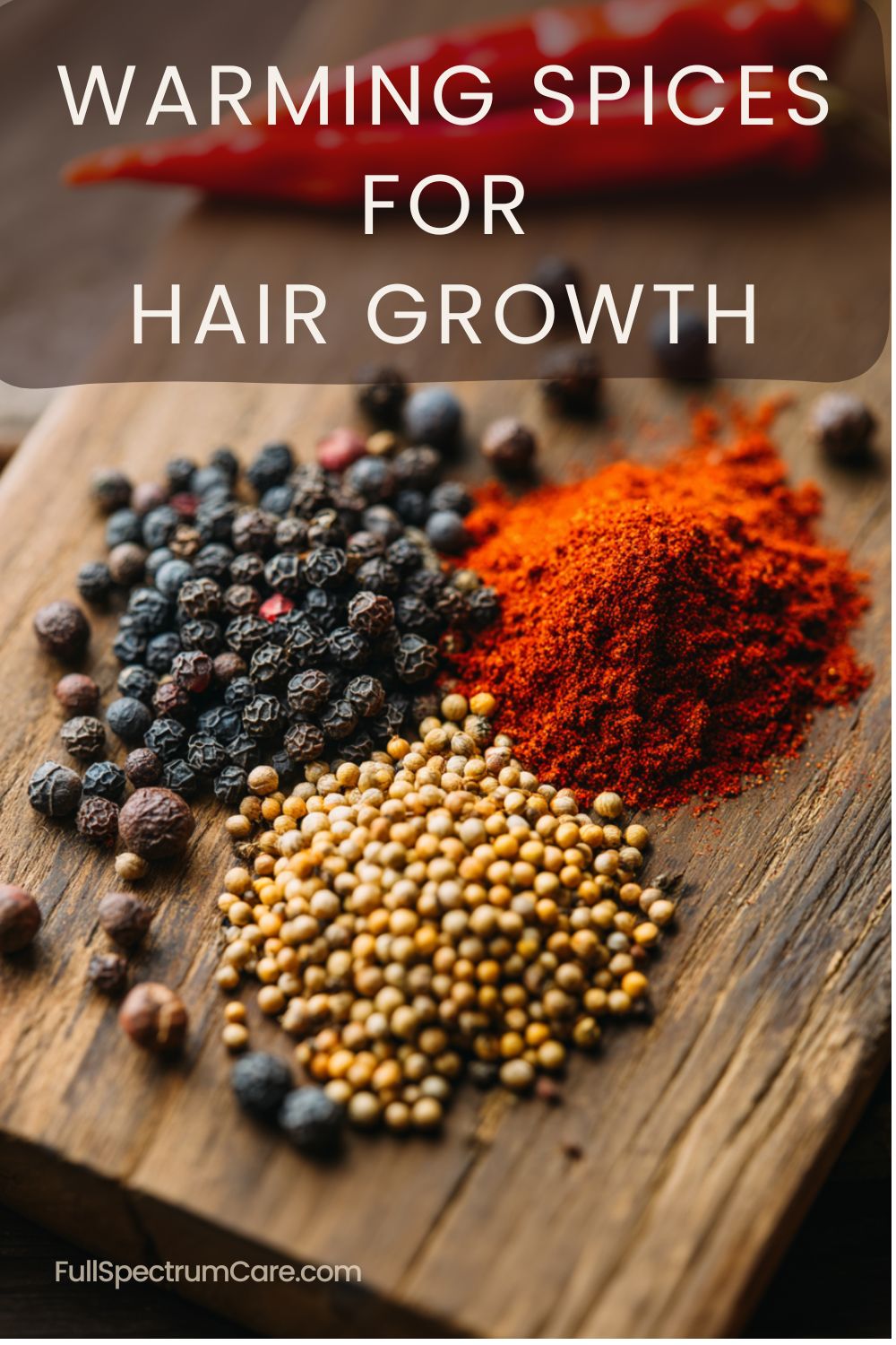 Natural hair growth treatment using warming spices like pepper, coriander, and chili powder on a wooden board.